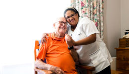 iStock-man-and-professional-caregiver-smiling_for-web