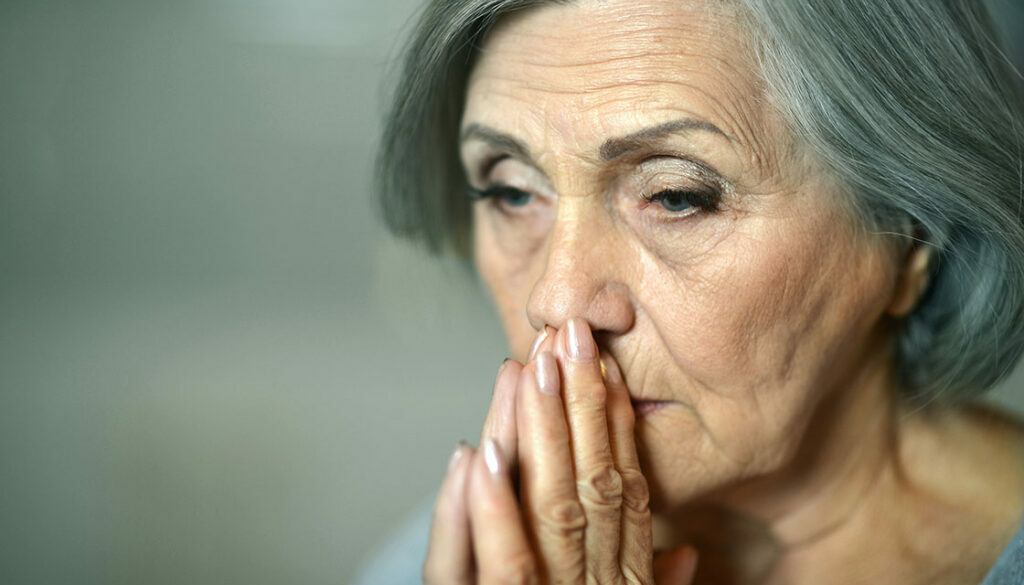 Thoughtful elderly woman