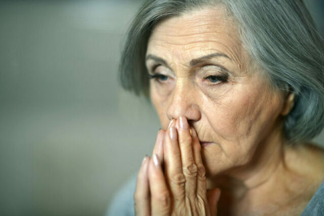 Thoughtful elderly woman